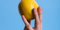 person holding lemon