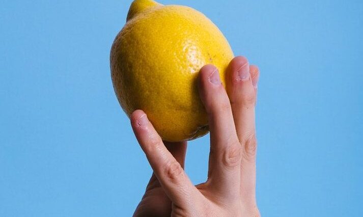 person holding lemon