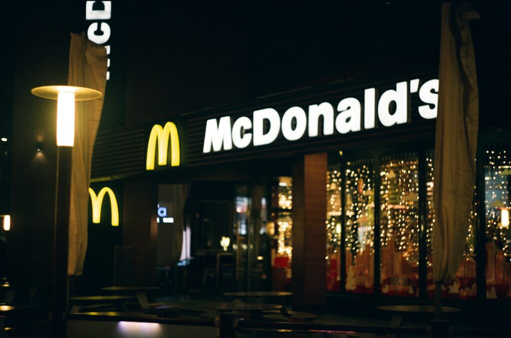 a mcdonald's restaurant lit up at night