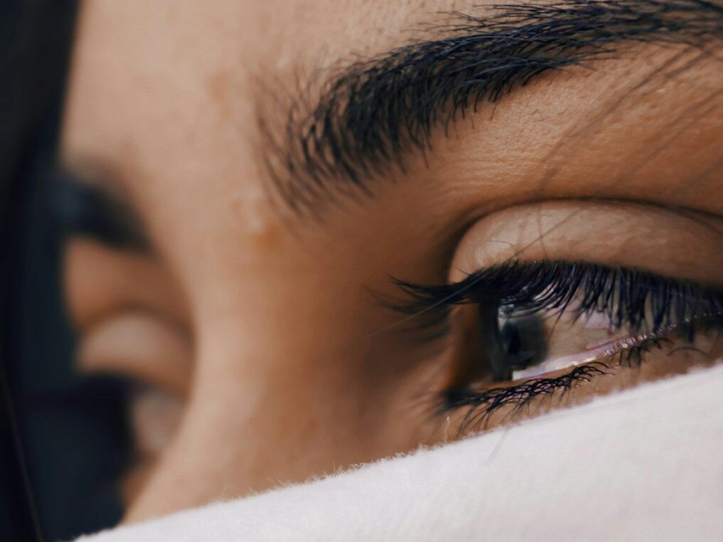 shallow focus of a woman's sad eyes