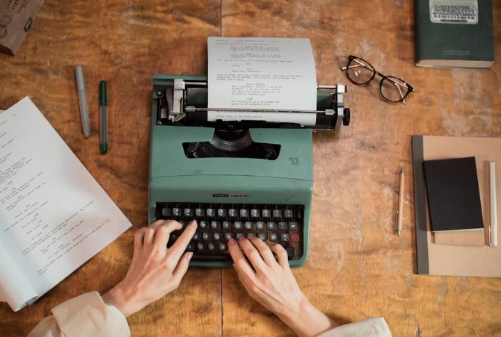 Typing School Papers On A Typewriter