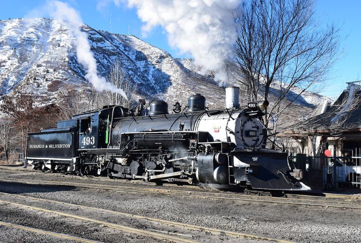 Winter Trains Run Through Snow-Covered Valleys