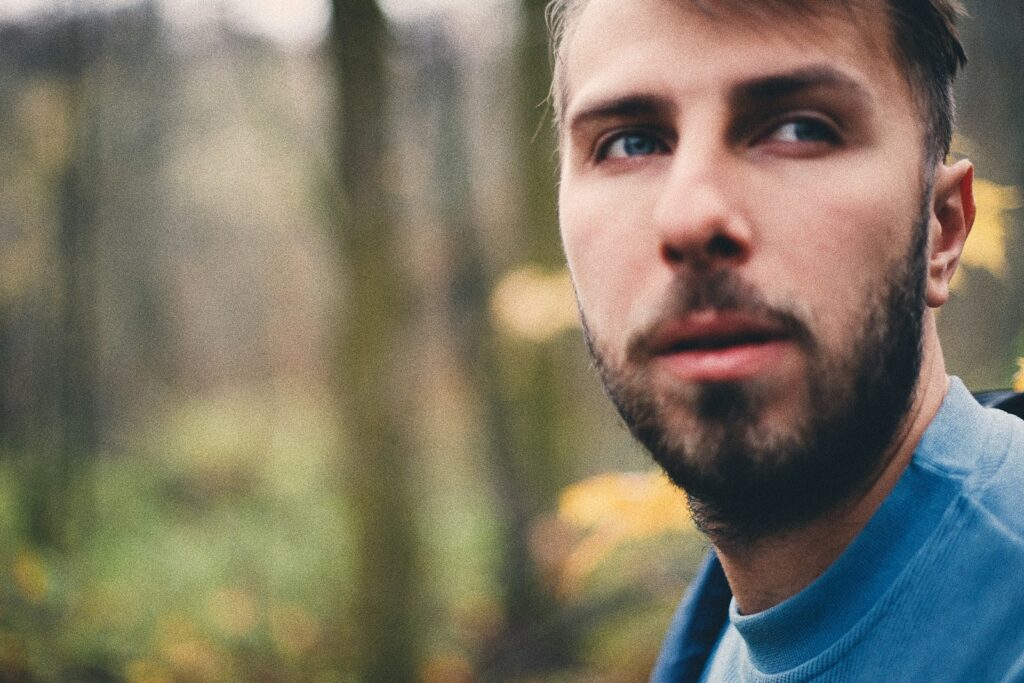 man in blue collared shirt