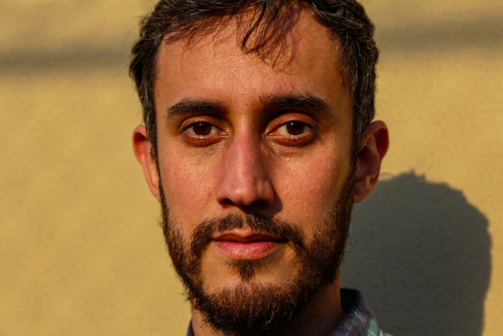 man in blue collared shirt