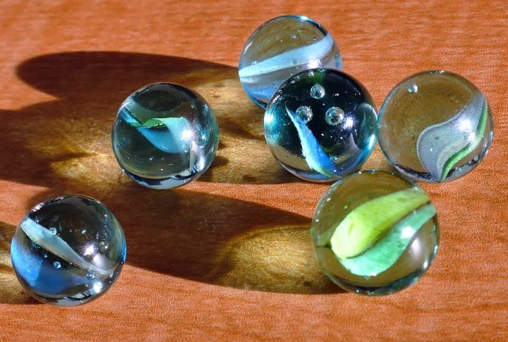 Playing With Marbles, Jacks, Or Pick-Up Sticks