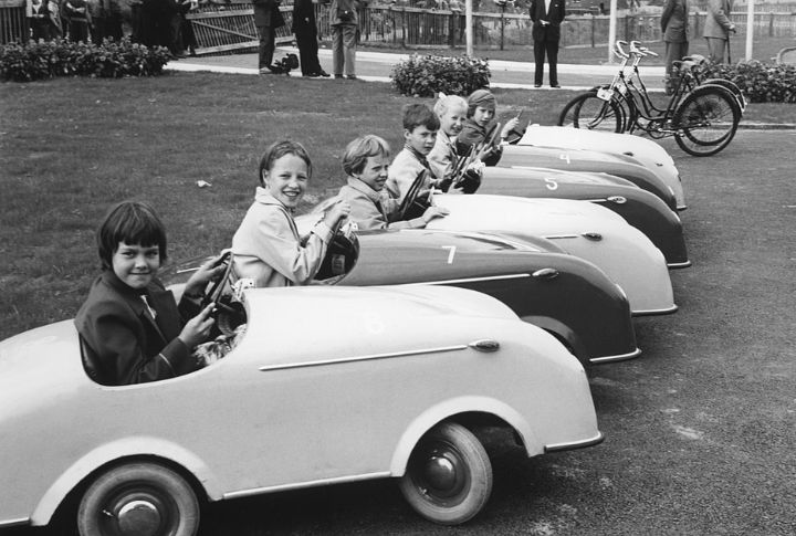 Tykes In Tin Cars And Tricycles