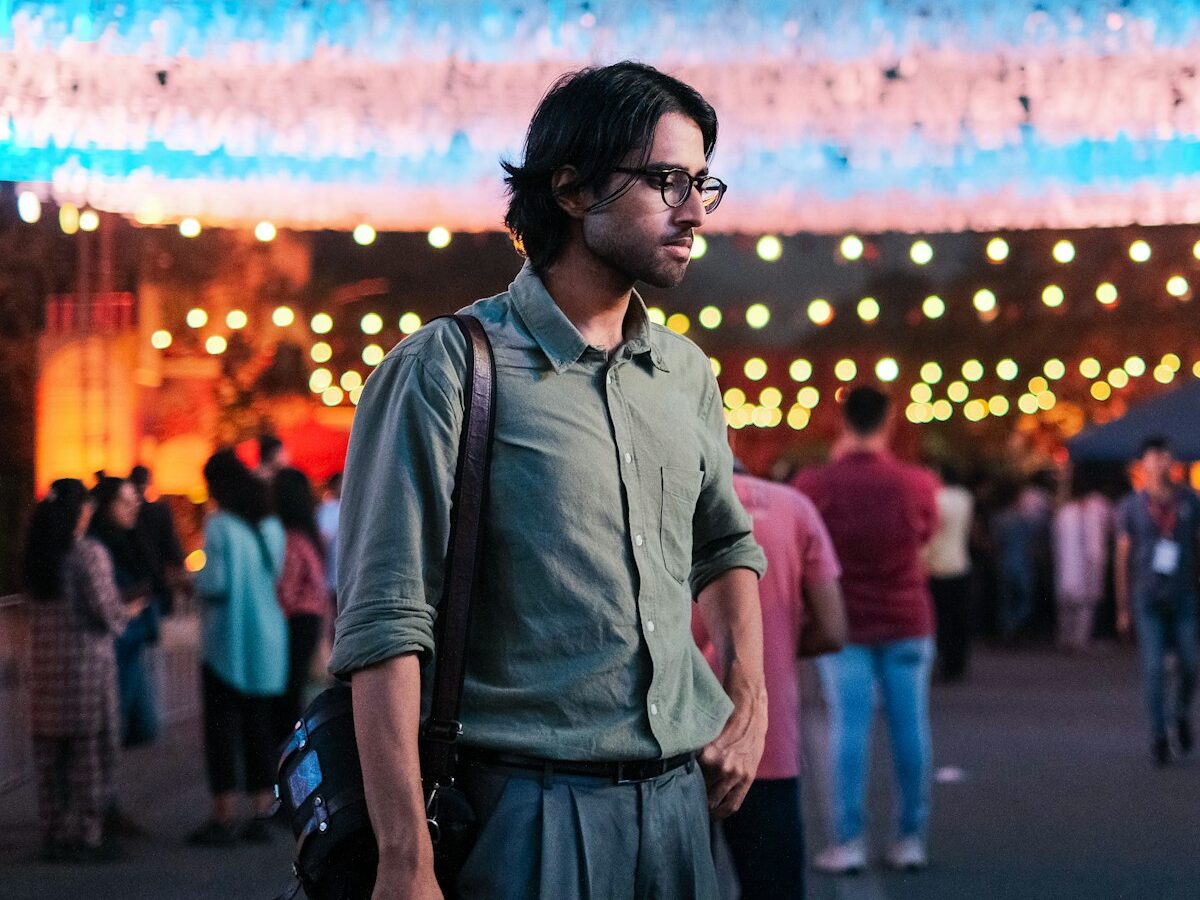 a man standing in front of a large display of lights